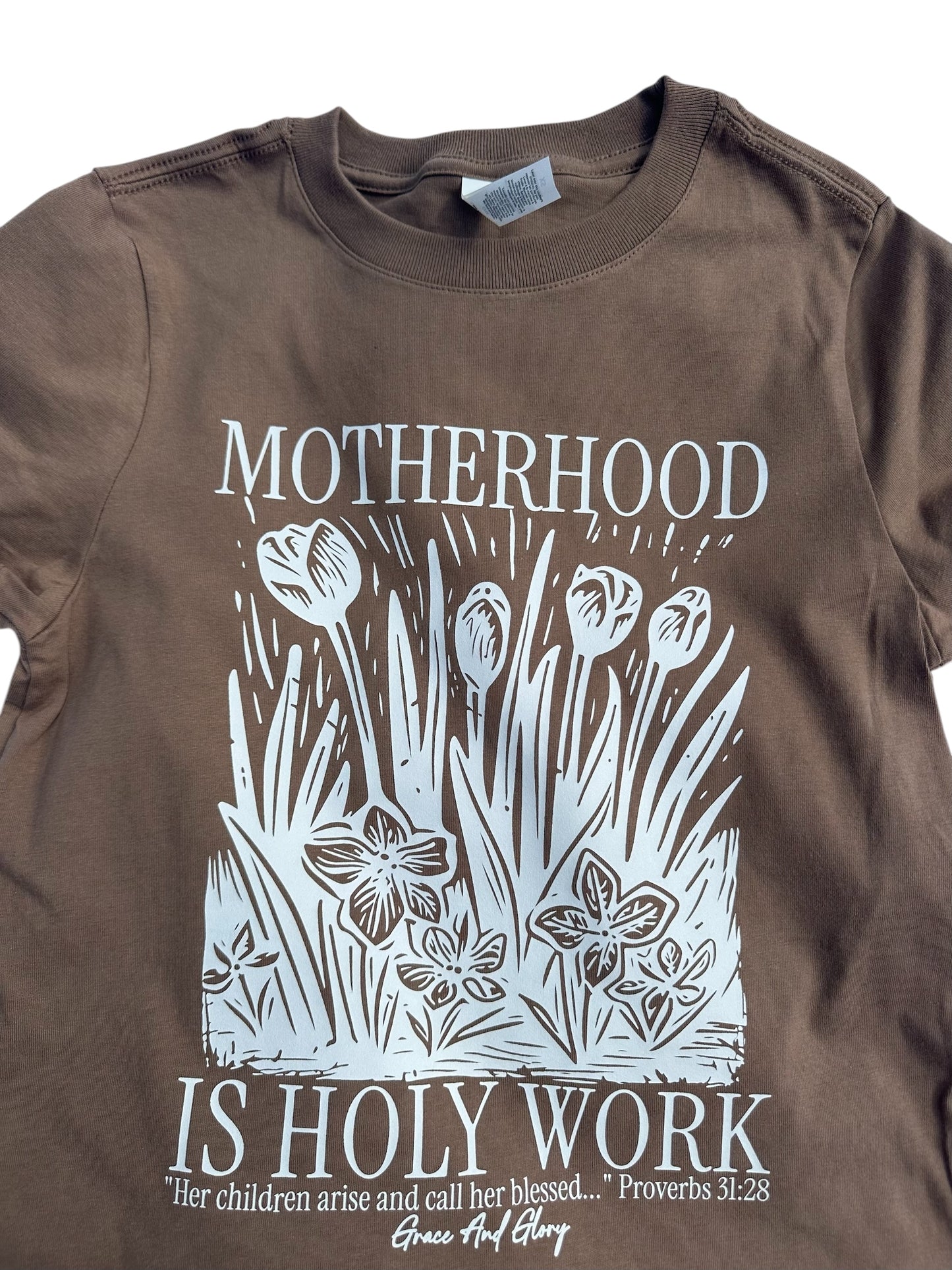 Motherhood is Holy Work Women’s Tee – Brown